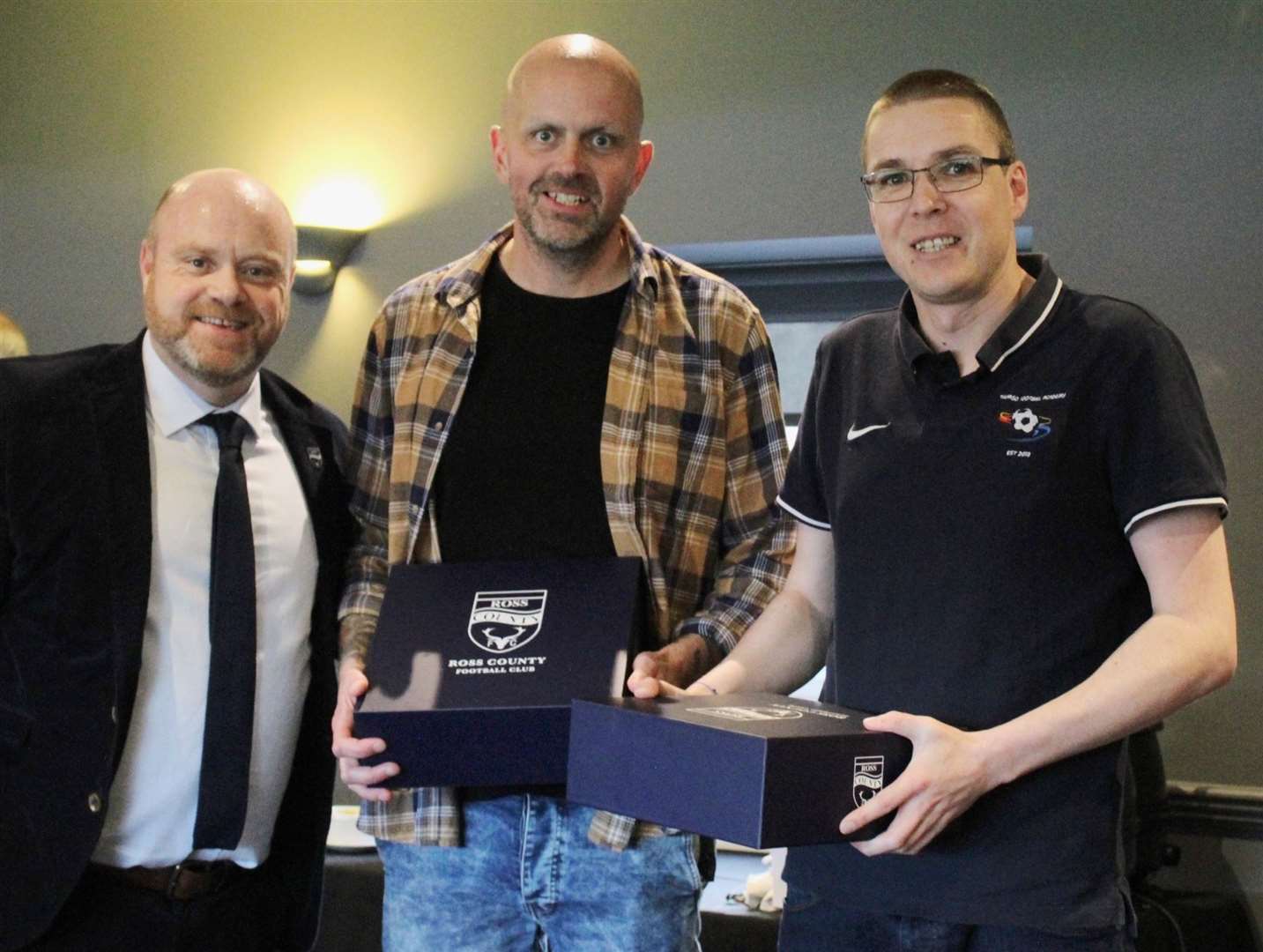 From left: Ross County chief executive Steven Ferguson with Thurso Football Academy's development officer Richie Campbell and head of coaching Alyn Gunn.