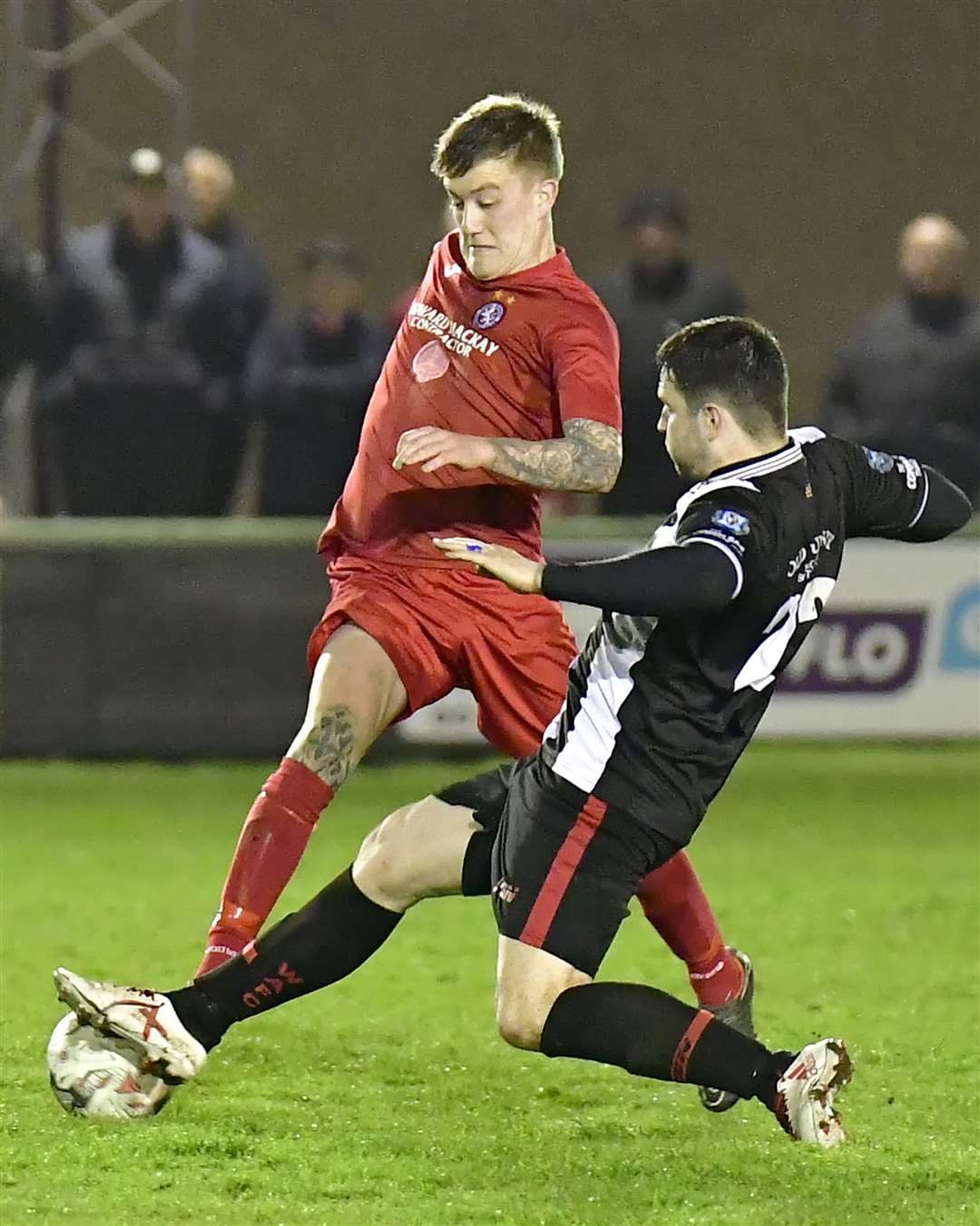 Sam Mackay of Wick Academy challenges Brora's Kyle Macleod during Wednesday's goalless draw. Picture: Bob Roger