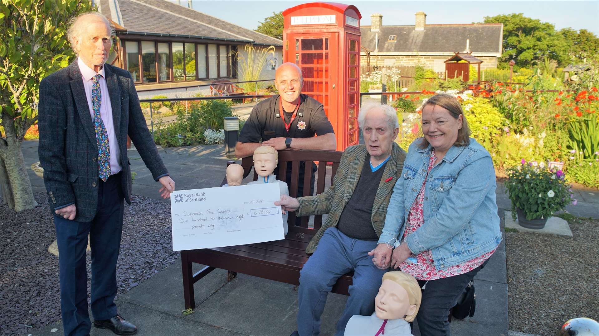 At the cheque handover event at Wick's Town and County Hospital were, from left, Neil Buchanan chair of Dunbeath and Berriedale community council, Dunbeath fire service group commander John Irvine, James Gunn and Rosemary Gunn. The money has gone to buy resuscitation Annies – CPR dolls for practicing lifesaving techniques on. Picture: DGS