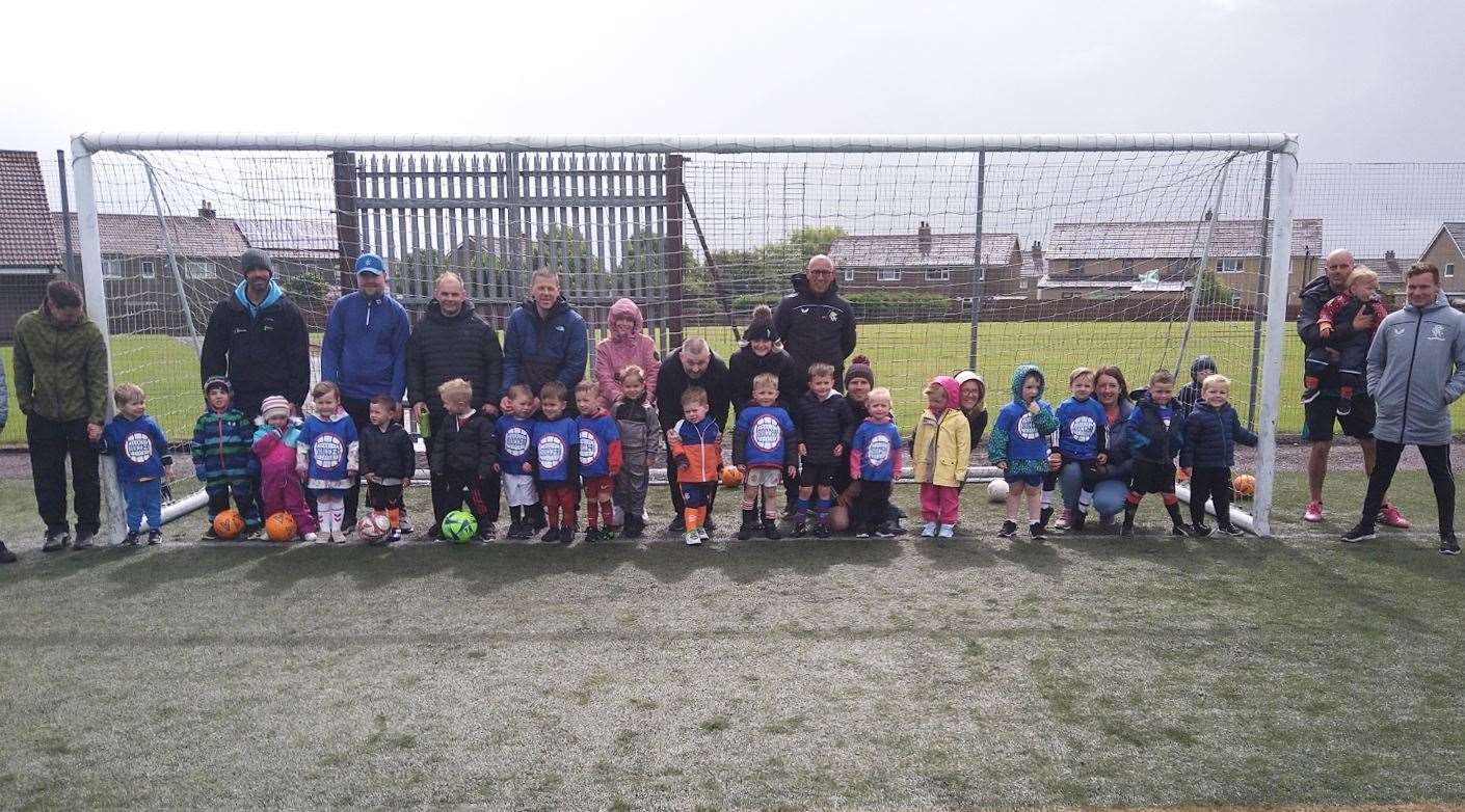 The youngest age group (two to four years) at Naver with Mark Hateley and some of the parents.