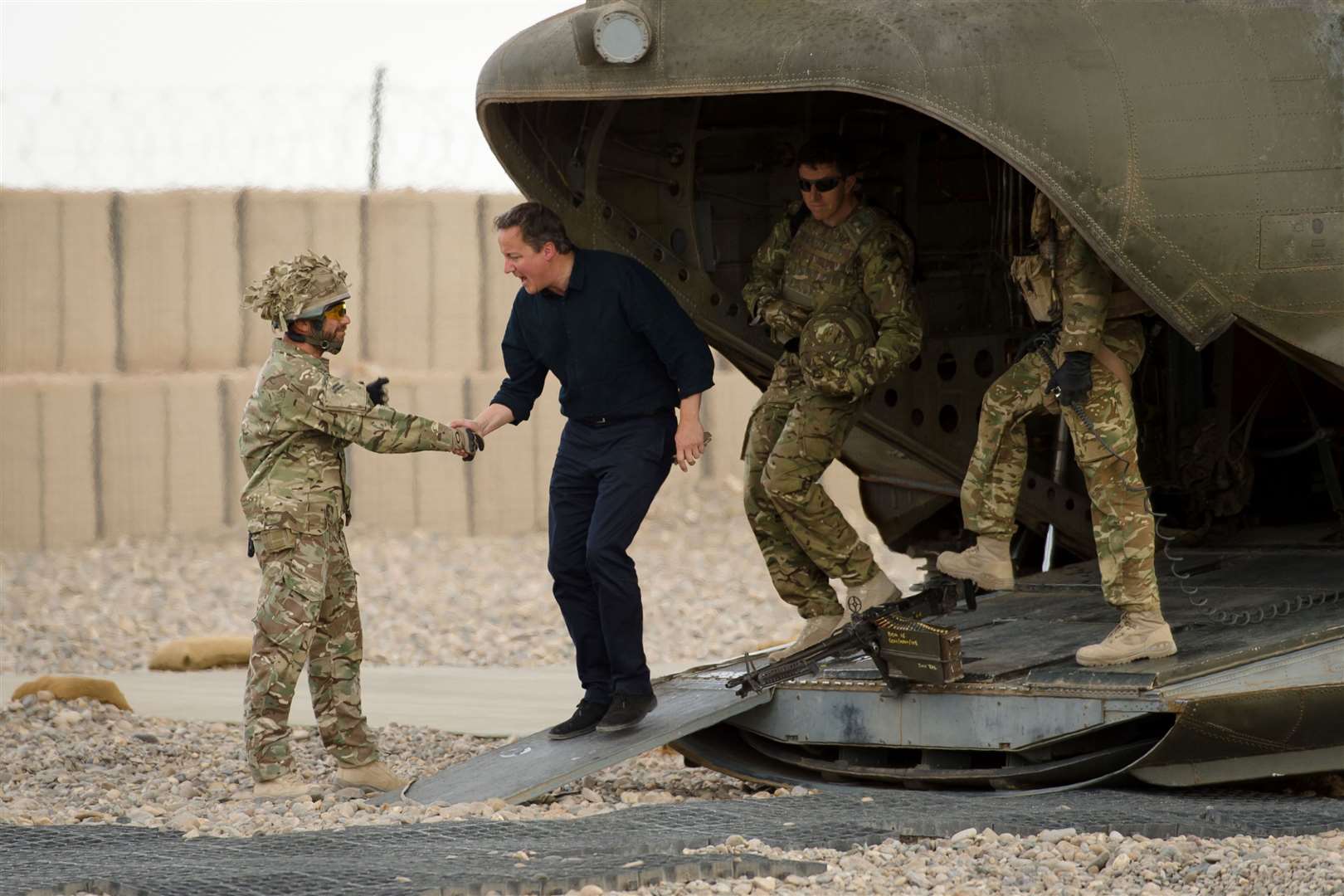Prime minister David Cameron is greeted as he arrives at Camp Bastion in Helmand province (Leon Neal/PA)