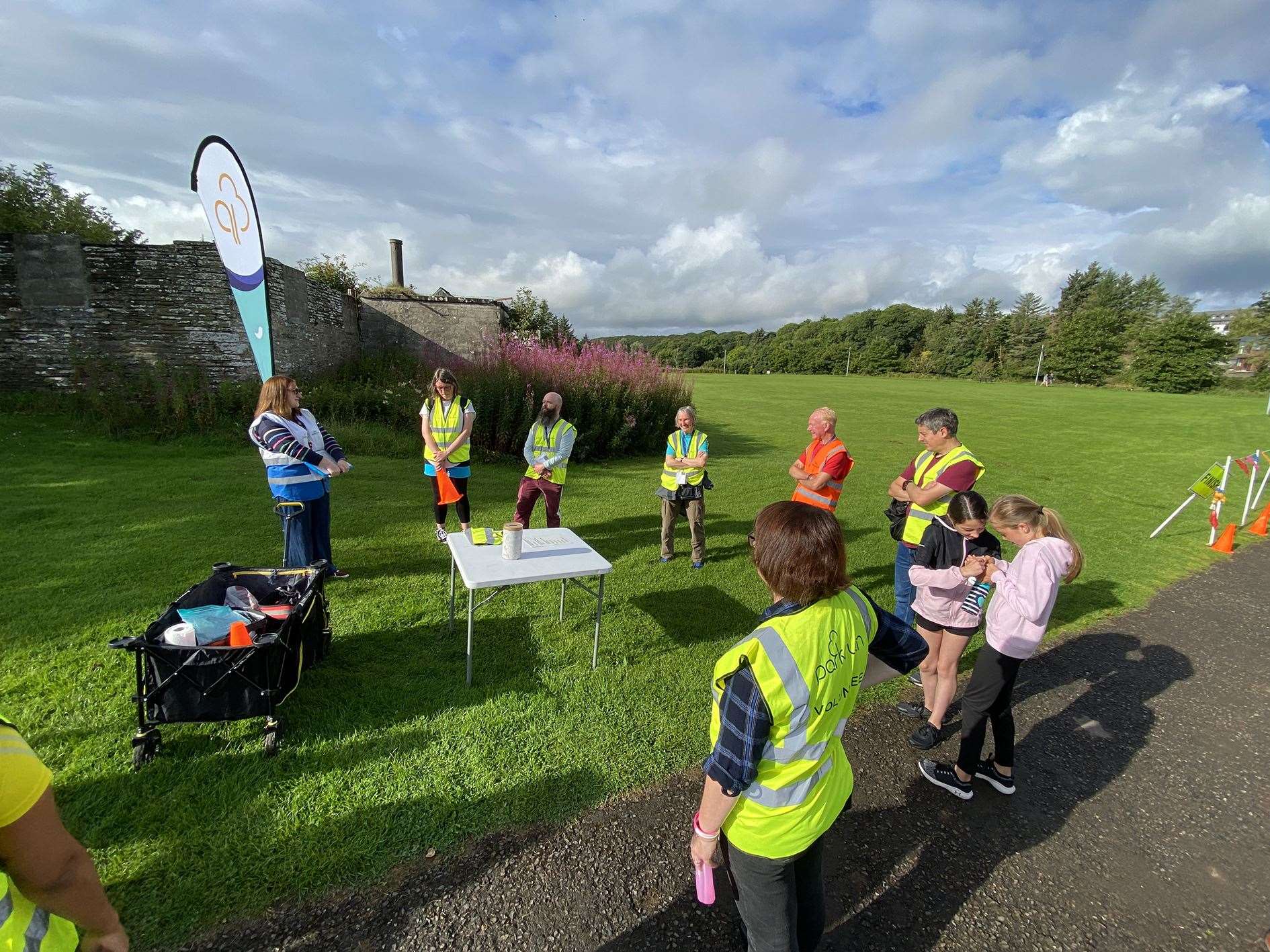 Volunteers listen to a briefing ahead of junior parkrun in Thurso last week.