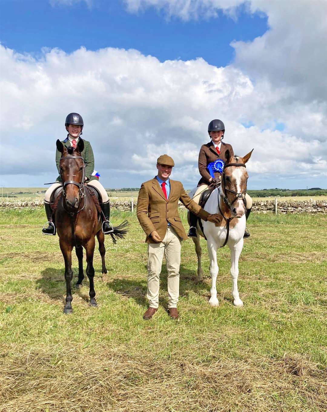 Working hunter pony champion Danielle Sinclair and reserve Erin Hewitson with judge Robert Auchnie.