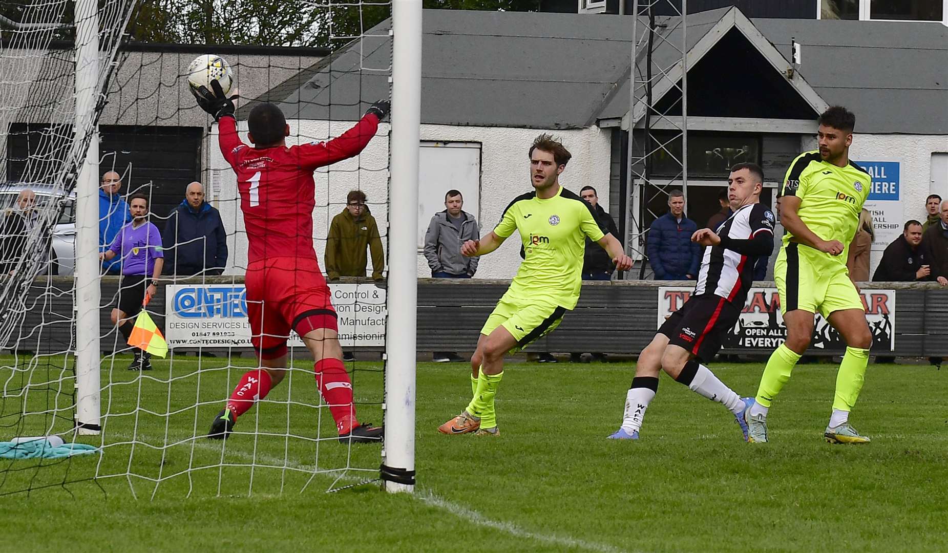 Wick keeper Graeme Williamson saves a header from Jeanfield Swifts' Dayle Robertson during the first half of Saturday's Scottish Cup tie at Harmsworth Park. Picture: Mel Roger