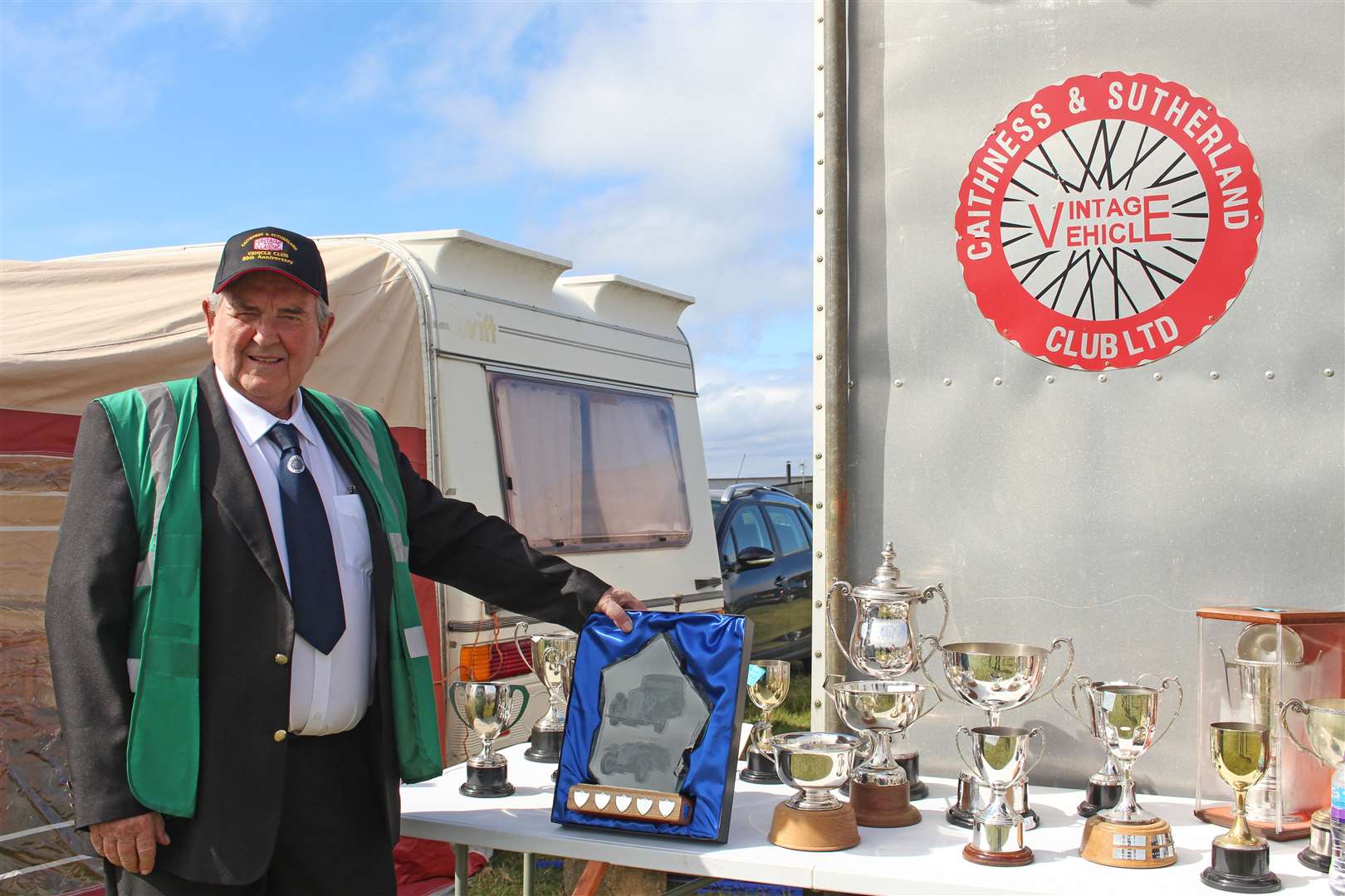 Chairman Bert Macleod with some of the club's trophies.