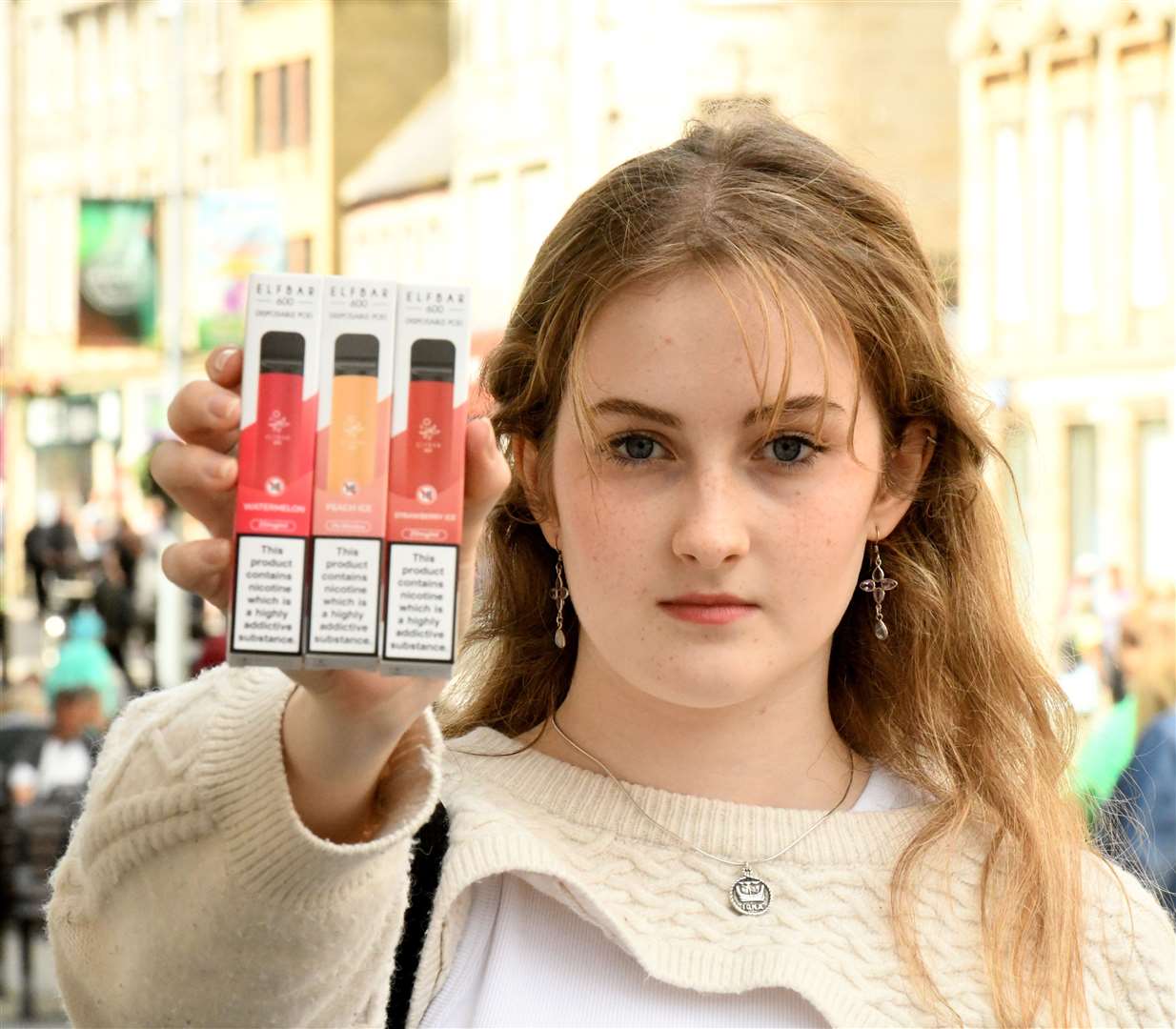 Iona MacDonald holding the e-cigarettes she was able to purchase. Picture: James Mackenzie.
