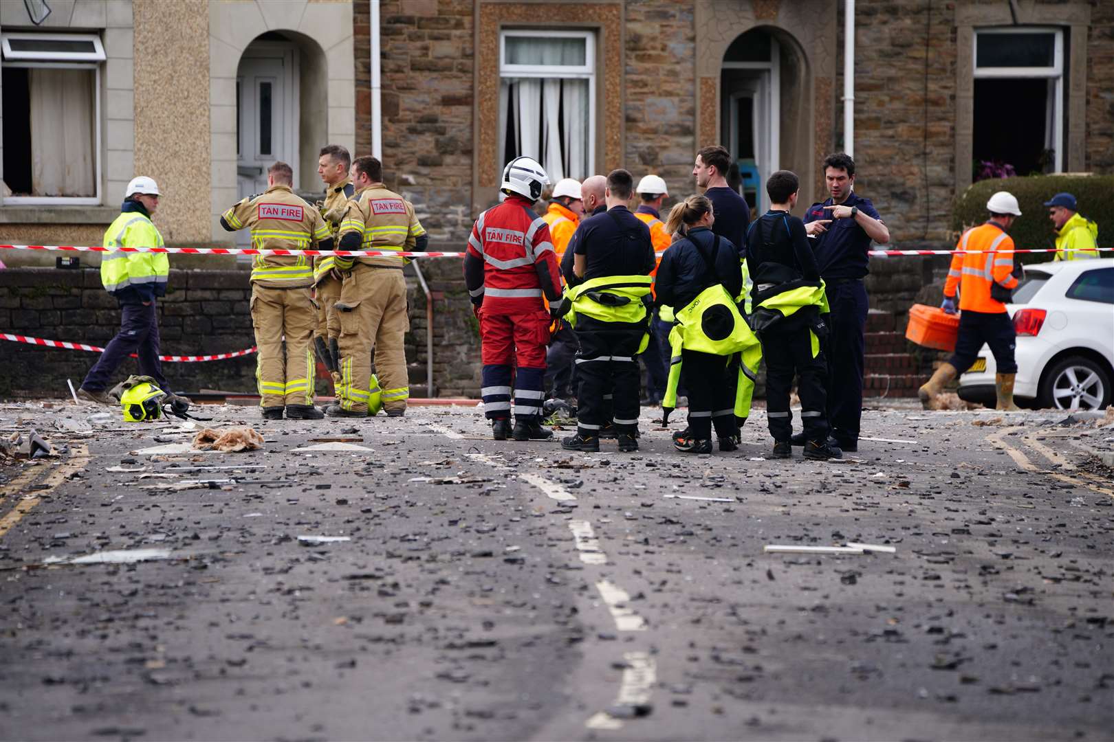 Emergency personnel at the scene after reports of a suspected gas explosion at a property on the junction of Clydach Road and Field Close in Morriston, Swansea (Ben Birchall/PA)
