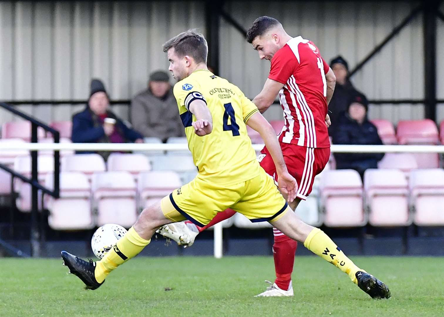 Wick Academy skipper Alan Farquhar launches himself at full stretch to thwart Formartine's Scott Lisle. The Scorries would go on to win 2-1 – their first victory since November 2. Picture: Mel Roger