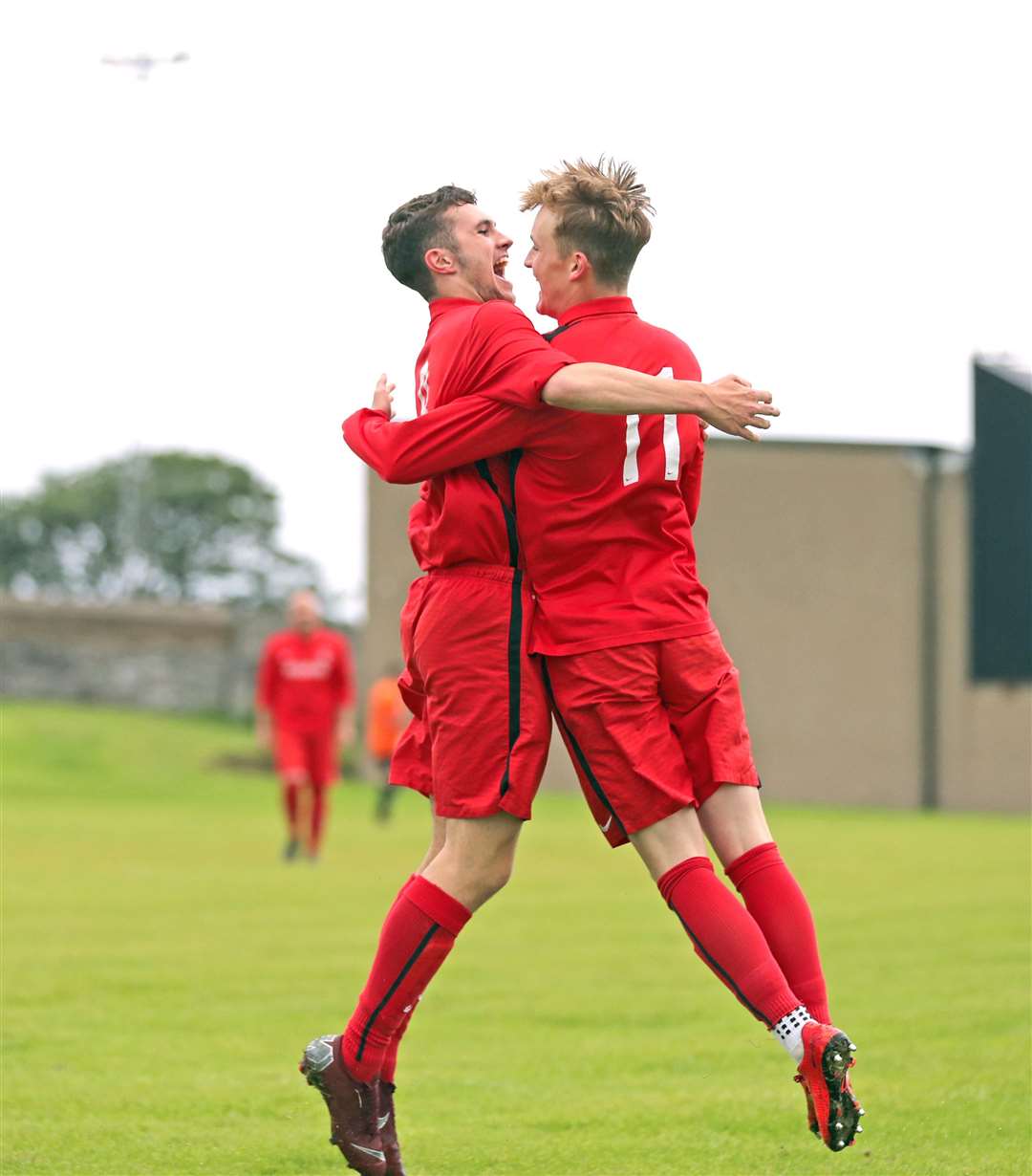 Wick Groats' Mark Macadie (number 11) is congratulated by Ben Sinclair on scoring their first goal during the 4-3 David Allan quarter-final win against Pentland United. Picture: James Gunn