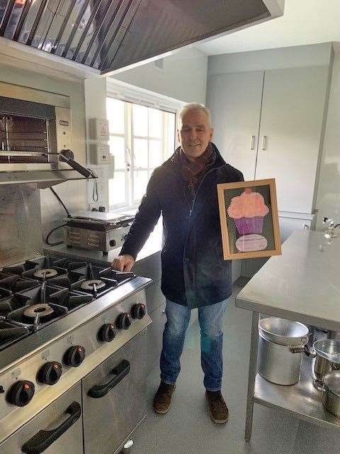 Highland councillor Karl Rosie after receiving one of the framed cupcake pictures.
