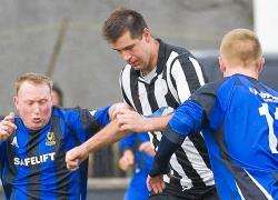 Wick’s Lukasz Geruzel shows his strength against Huntly.