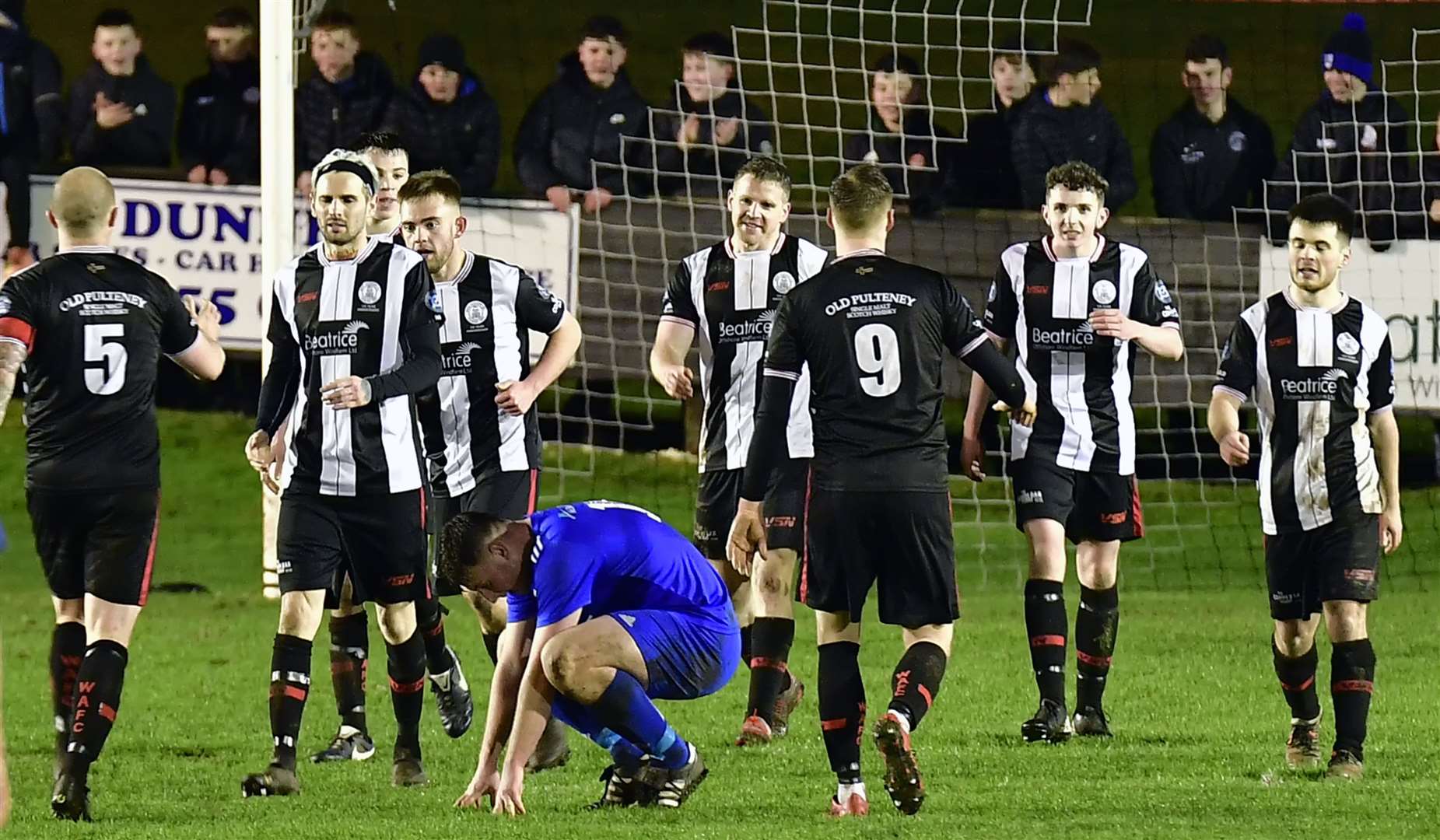Liam Bremner (second from left) played as a trialist in Wick Academy's 2-0 win against Lossiemouth in December when he came off the bench with a quarter of an hour to go. These were the celebrations after Davie Allan scored to wrap up the points. Picture: Mel Roger