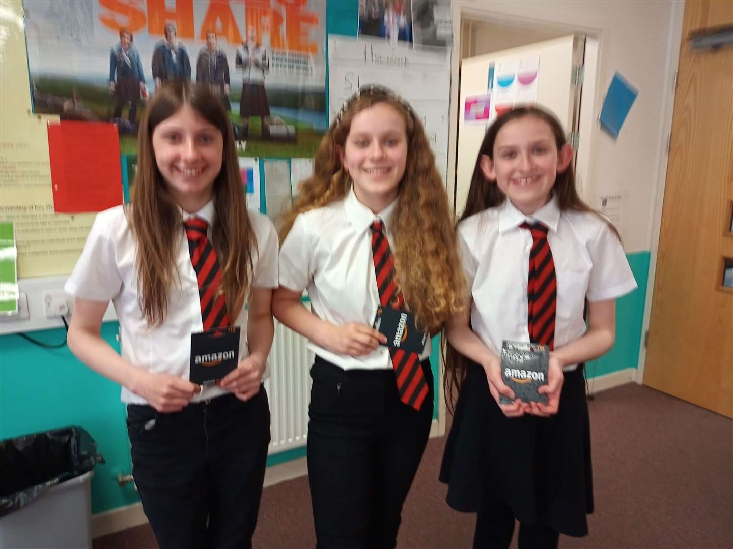 From left: Antonia, Georgia and Emily from S1 with their Amazon voucher prizes.