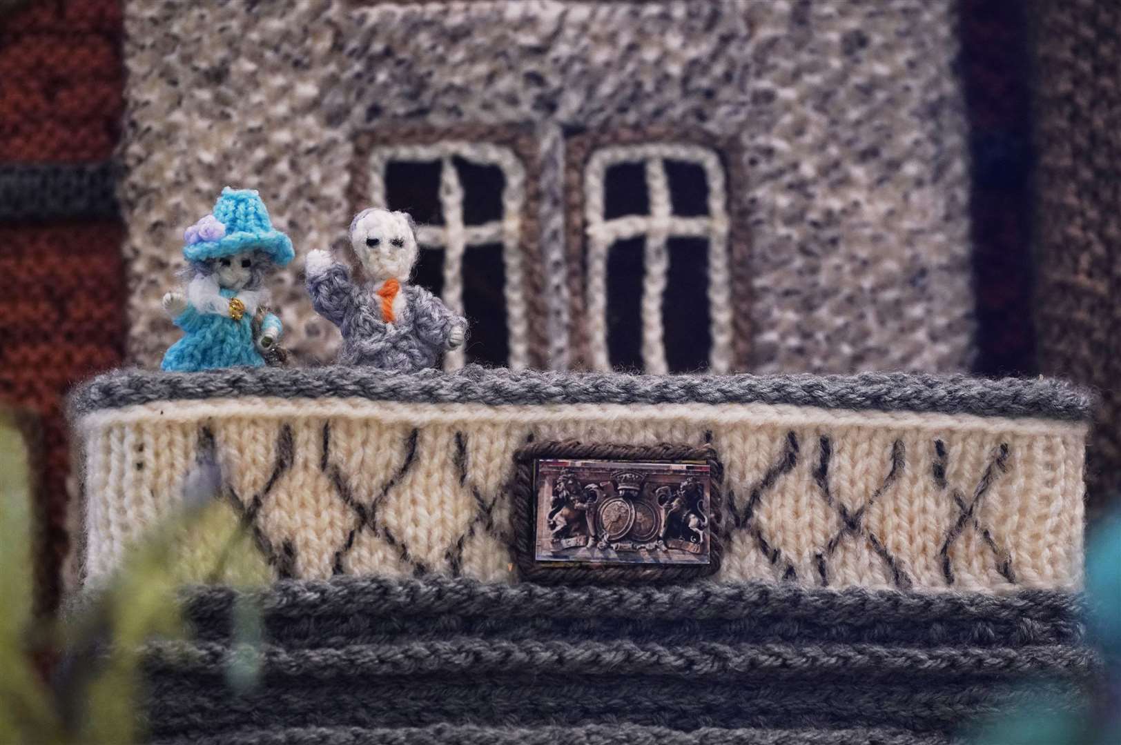 The knitted Sandringham model includes miniature woollen versions of the Queen and the Duke of Edinburgh on a balcony (Yui Mok/PA)