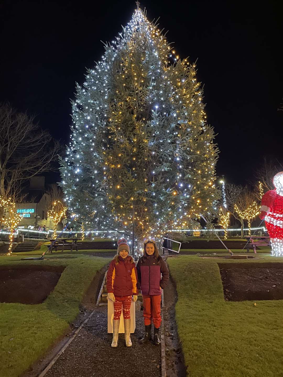 The lights were switched on by Chloe Rosie (right) and her friend Amy Andrews.