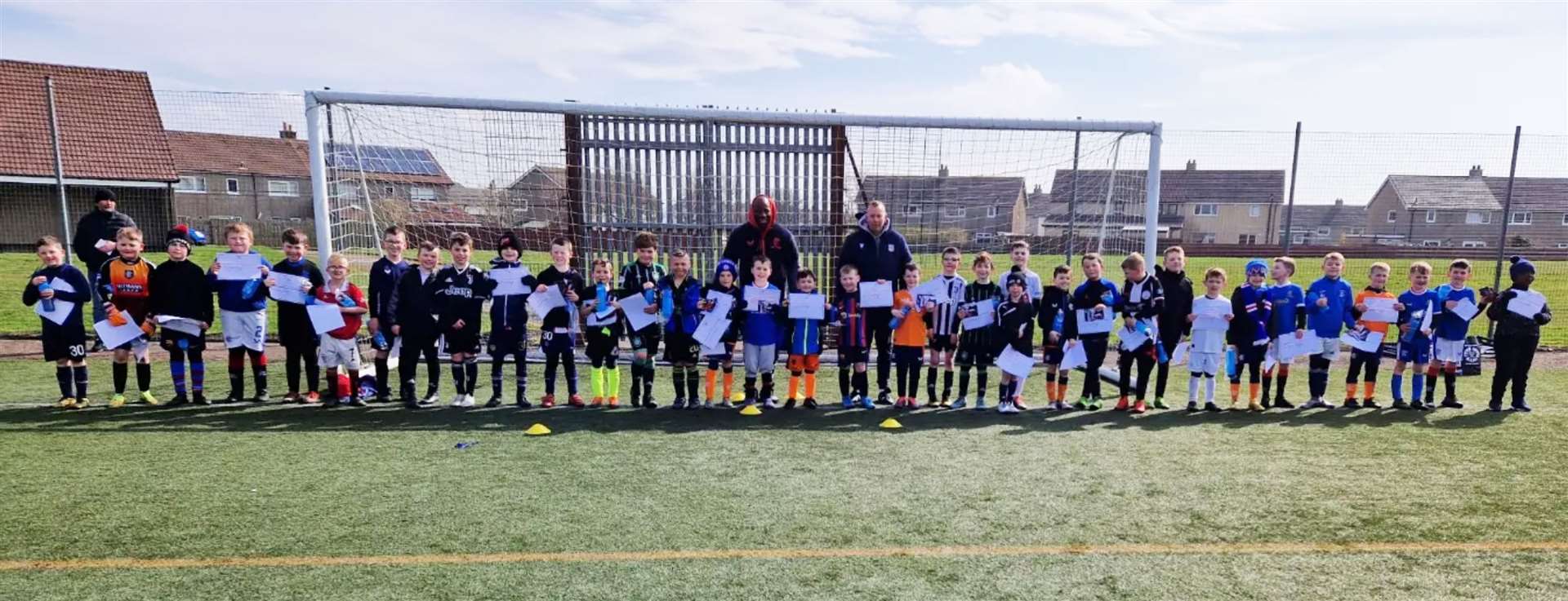 Youngsters in the 6-9 age group with Marvin Andrews and Stephen Wright.
