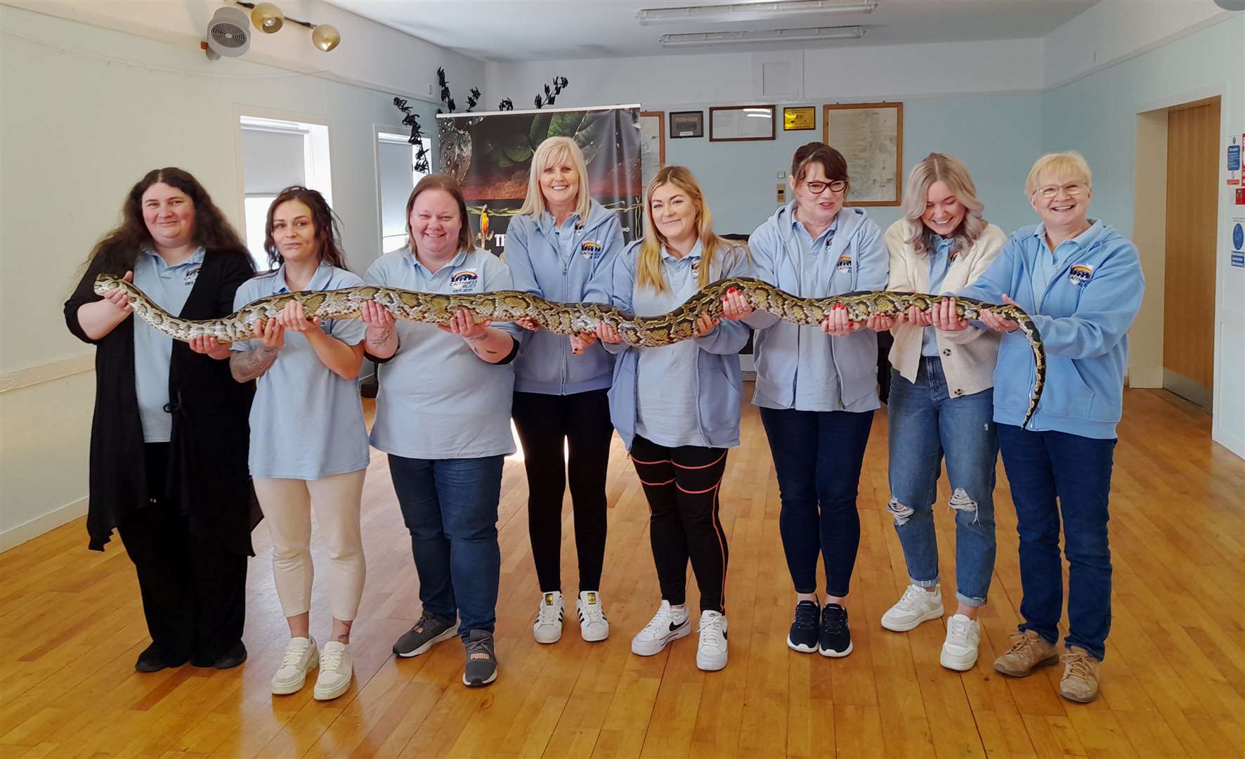 Caithness Klics staff holding Hufflepuff, a Burmese python, during the charity's 10th anniversary party in Staxigoe. Picture: Blair Mackenzie