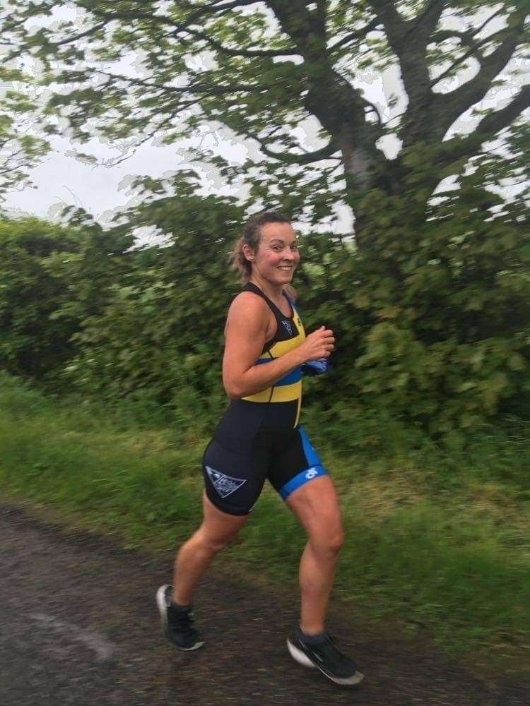Wick Triathlon Club member Helen McCarthy out running in her striking new kit featuring the colours of the Caithness flag.