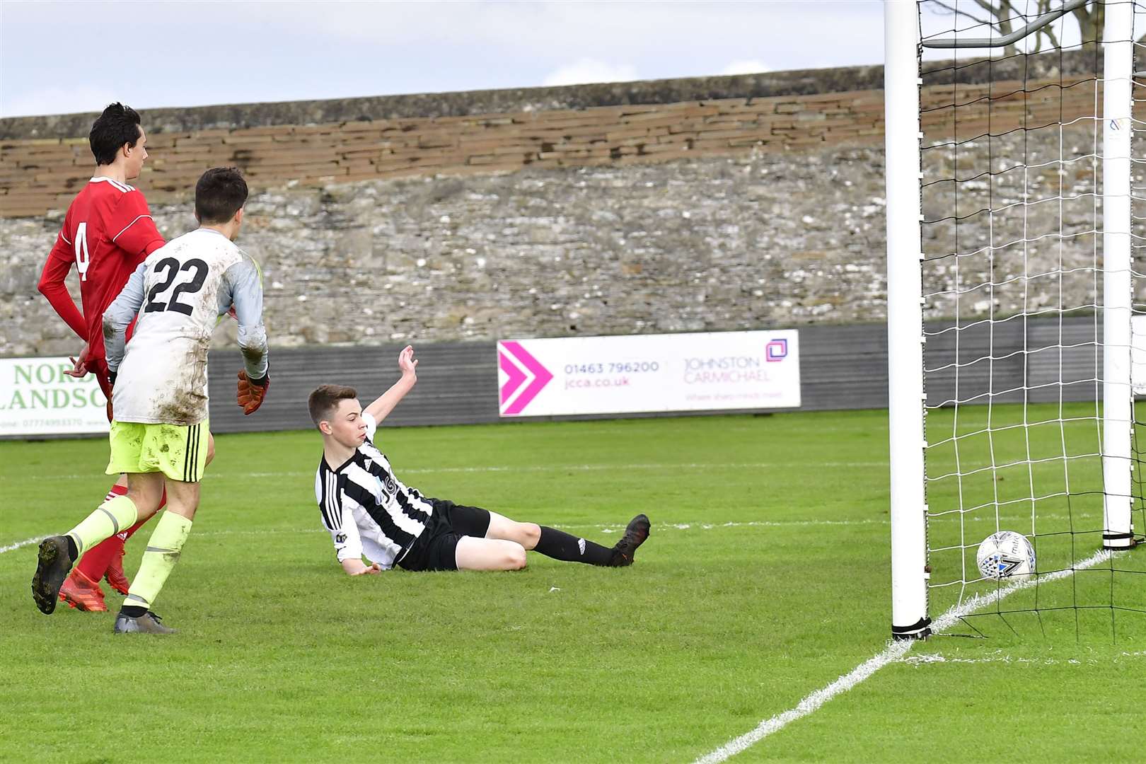 Conor Farquhar slides in to score Academy's third goal of the afternoon. Picture: Bob Roger