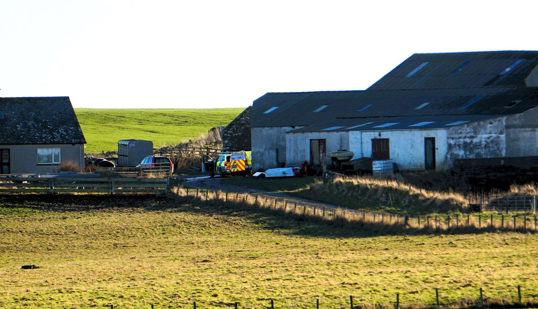 Two police vehicles were seen stationed at the Barns of Hempriggs farmhouse. Picture: DGS