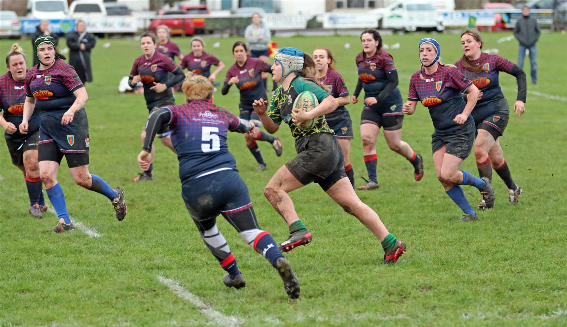 Olivia Henderson is surrounded by opponents as she makes a break during the Krakens' recent 29-24 win against Stornoway. Henderson is one of several players who are set to return to the squad this weekend. Picture: James Gunn