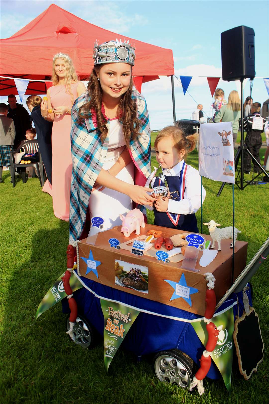 Mia Miller, Harrold Brothers’ Young Apprentice, receiving her supreme award from gala queen Anna Durrand. Picture: Alan Hendry