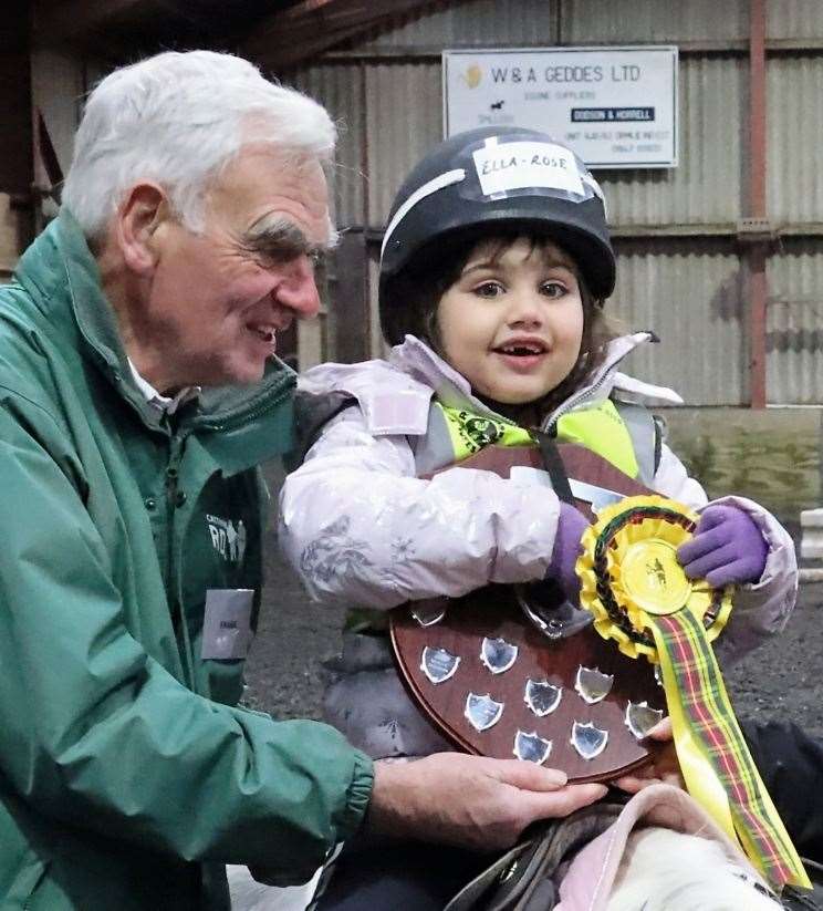 Ella-Rose Hossack receiving her trophy from Frank Stephen. Picture: Neil Buchan