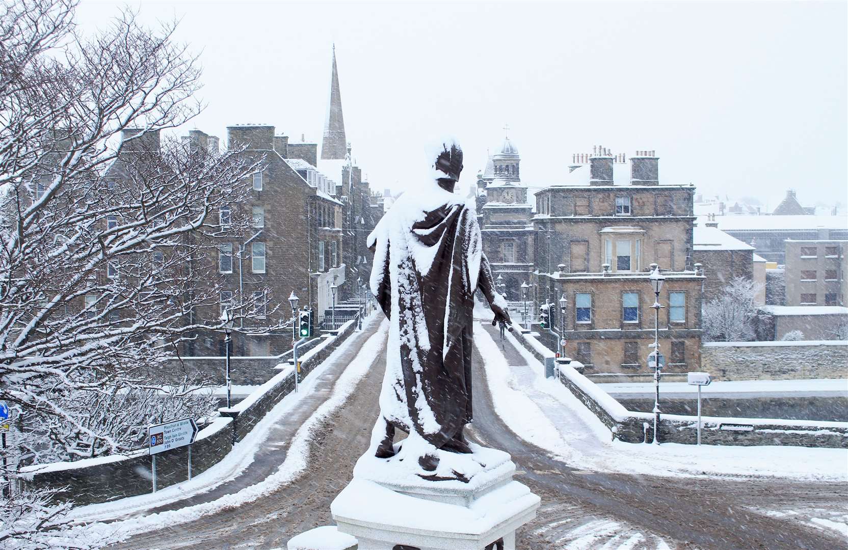 The snow-covered Wick war memorial overlooking Bridge Street. Picture: Alan Hendry