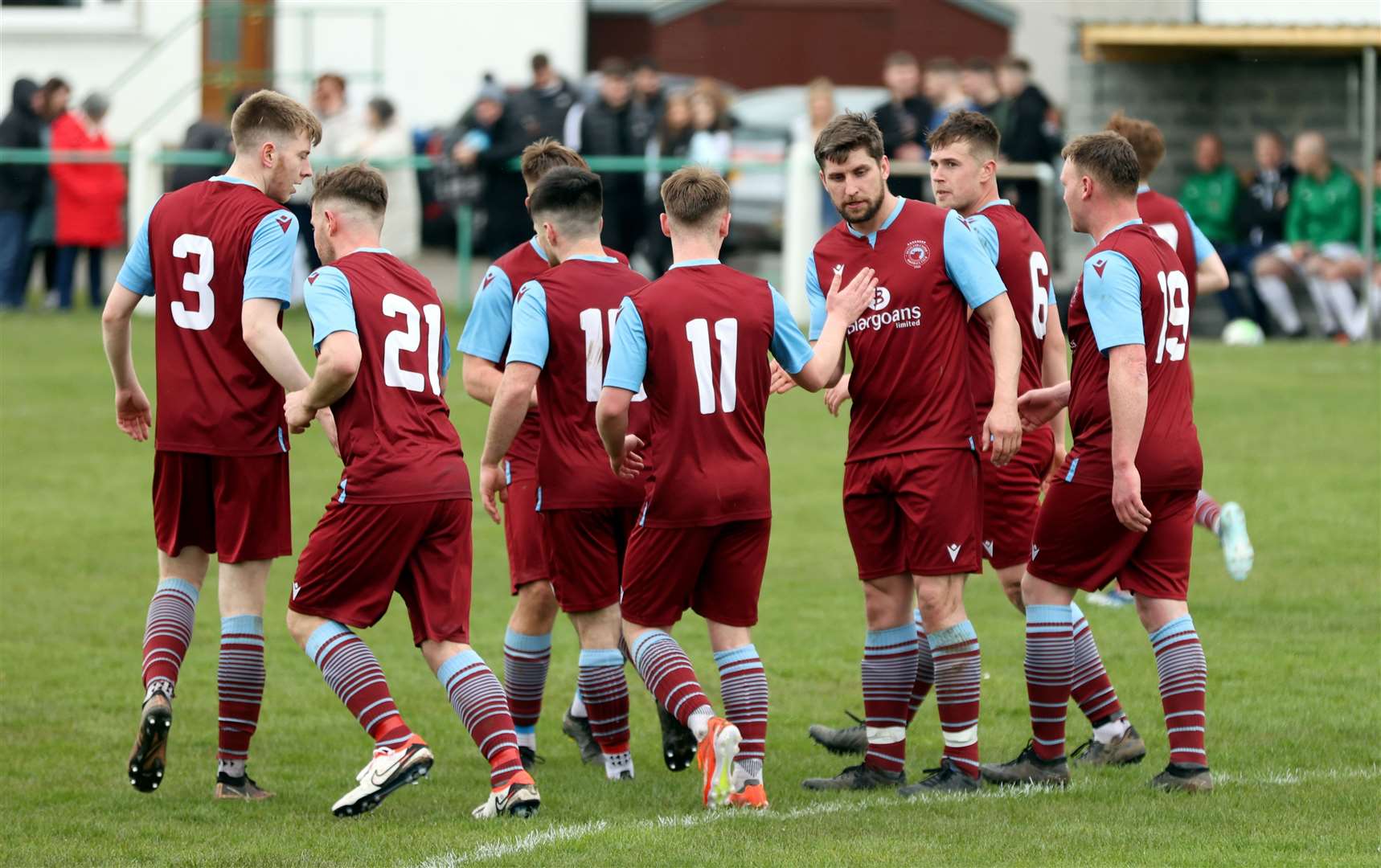 Team-mates congratulate Grant Steven after his goal for Pentland United. Picture: James Gunn