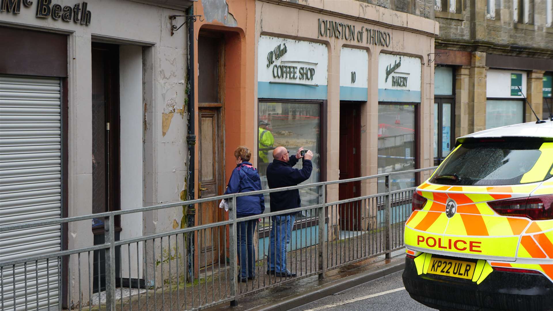 A pedestrian takes a snapshot at the scene. Picture: DGS