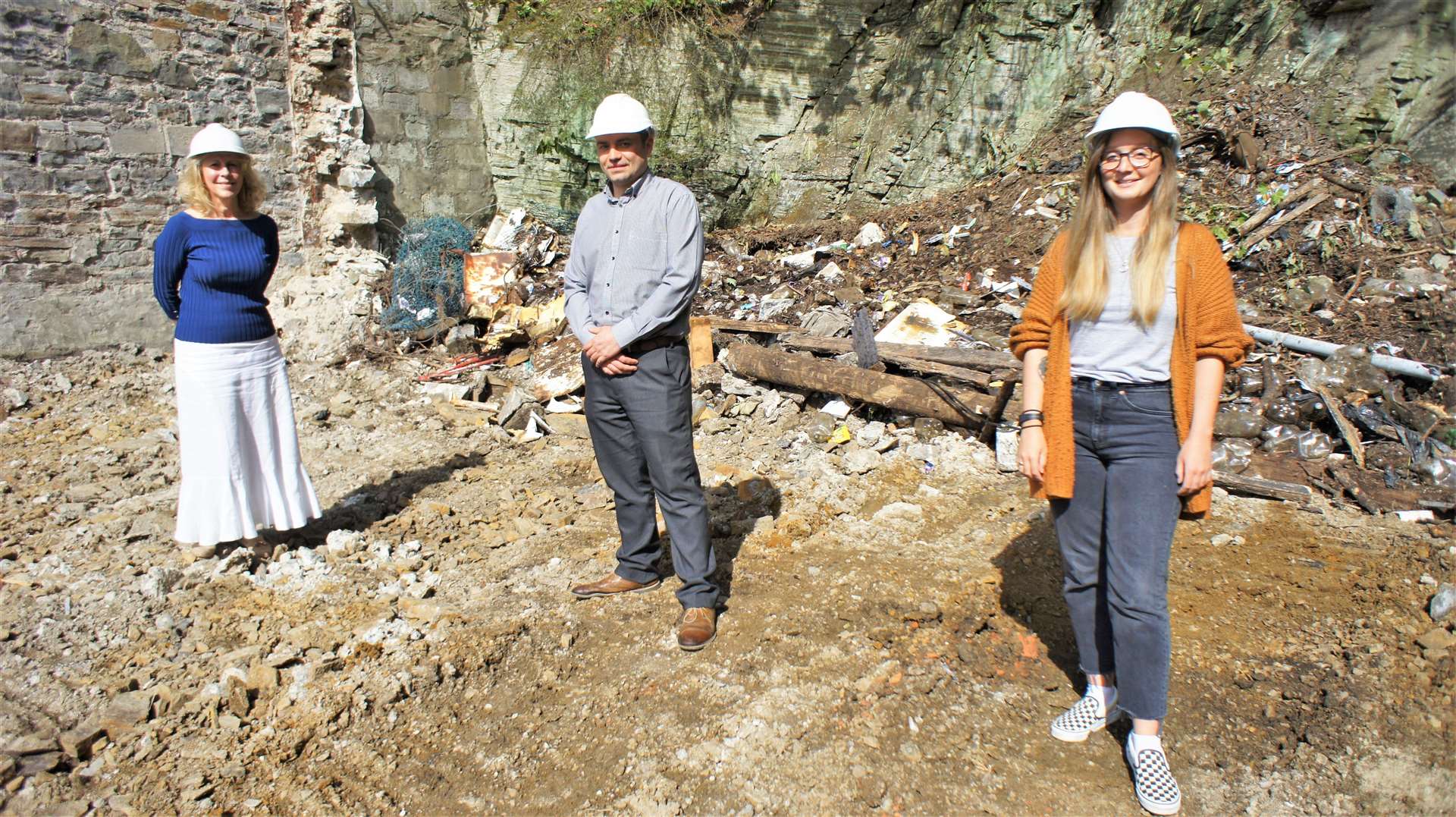 From left, Ellie Lamont, Jonathan Miller and Charlotte Mountford of Wick's Heart at the cleared site on Wick's High Street on Friday afternoon. Pictures: DGS