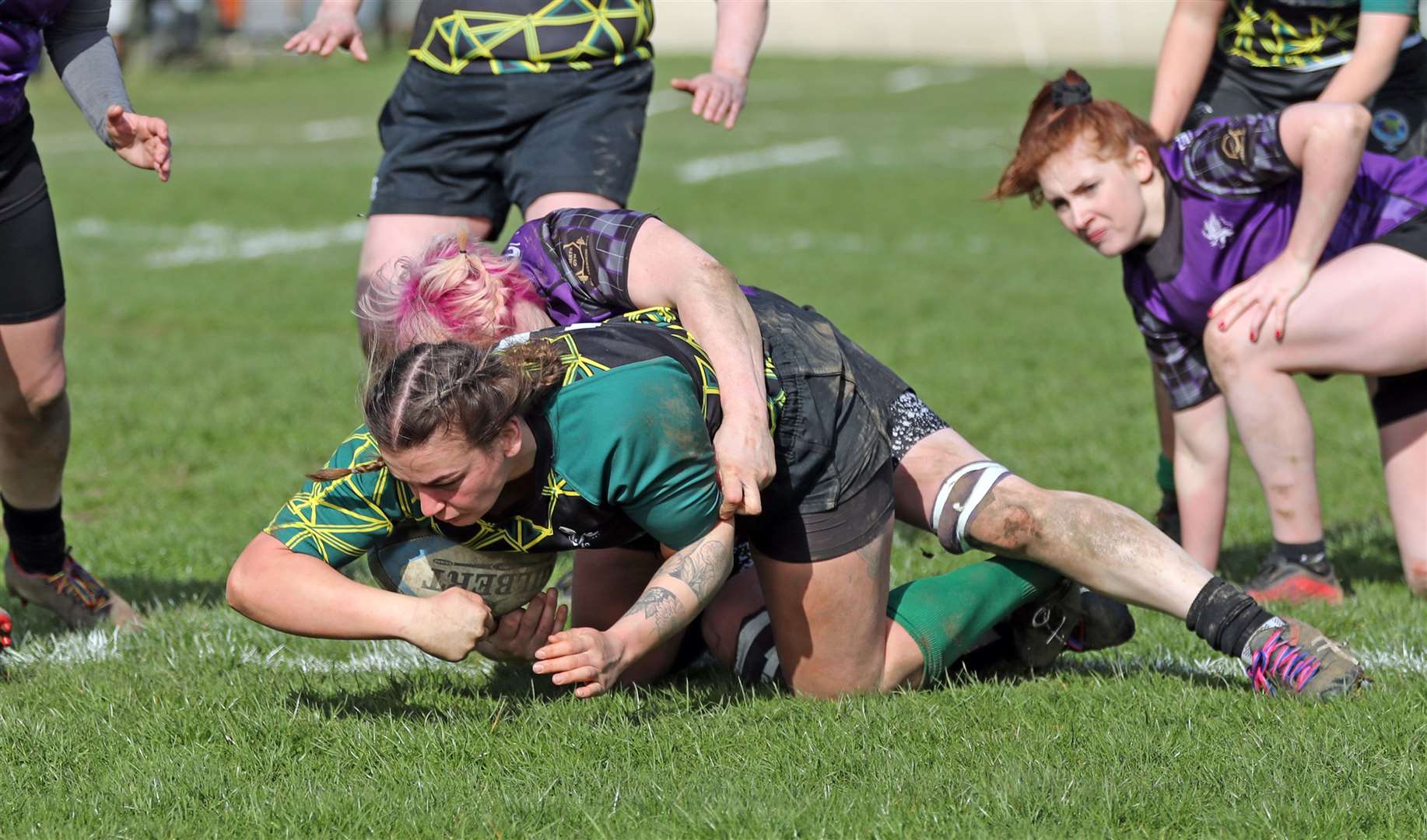 Emmy Smith touches down to score despite being tackled by a Strathmore player. Picture: James Gunn