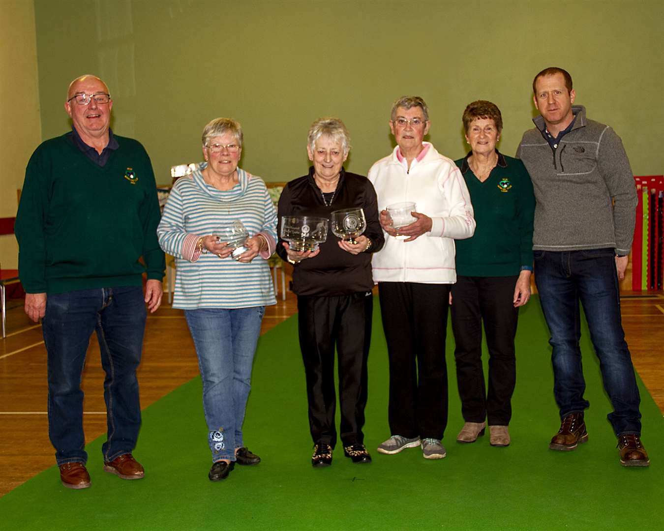John Braid (left), president of Reay Bowling Club, and winners Kath Irons, Joan Bridge and Pam Barney, with Lillian Campbell and William Campbell (right).