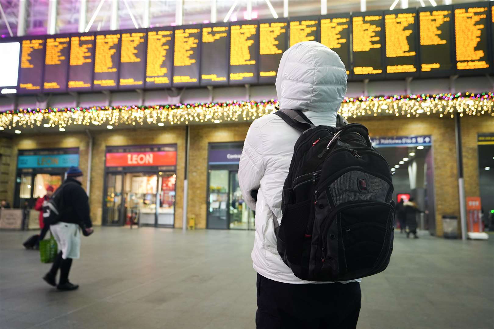 Passengers at Kings Cross Station in London during strike action by members of the RMT (James Manning/PA)