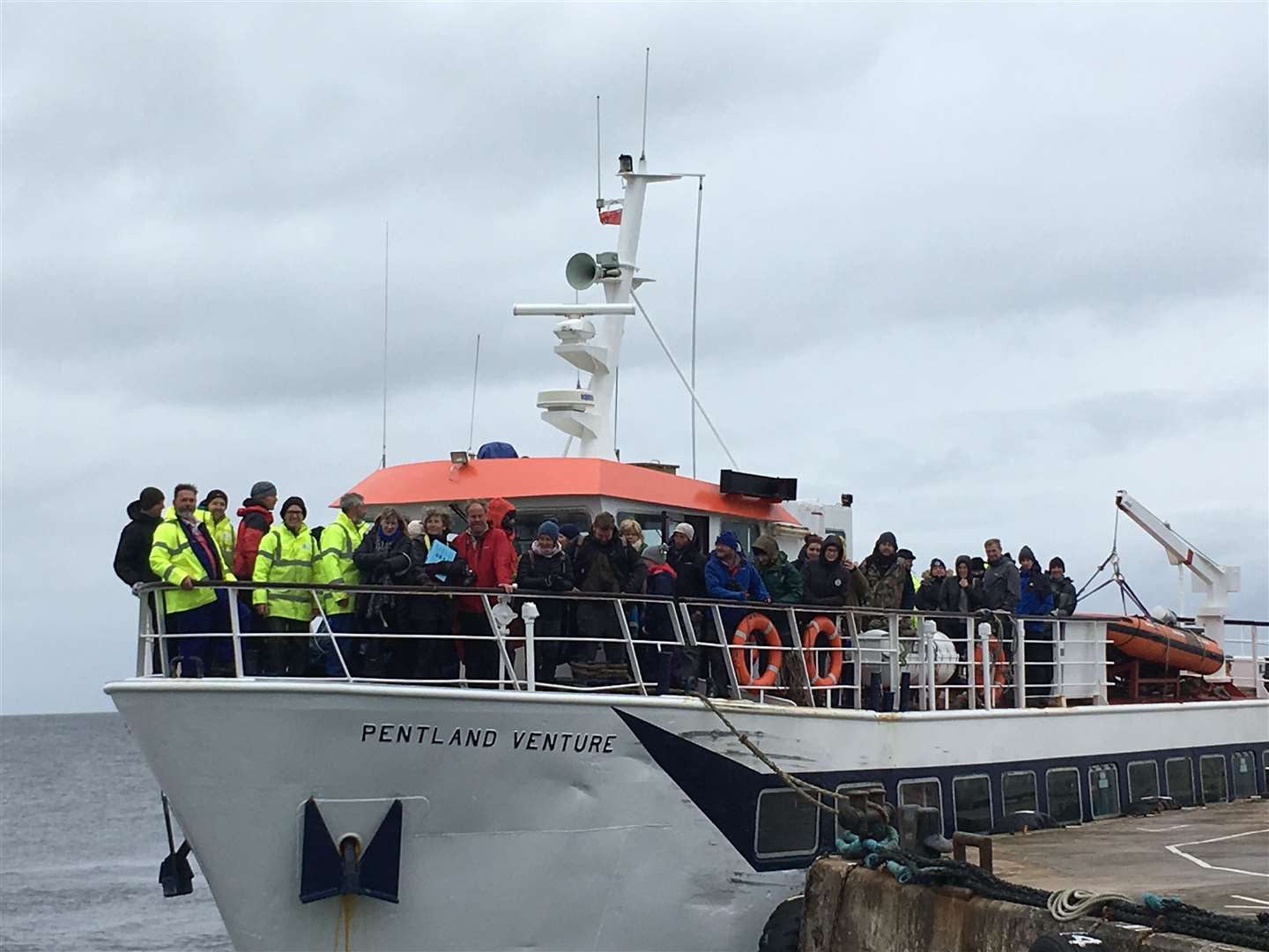 Orca watchers and the crew of the Pentland Venture at John O’Groats harbour on Sunday. Picture: Fred Fermor