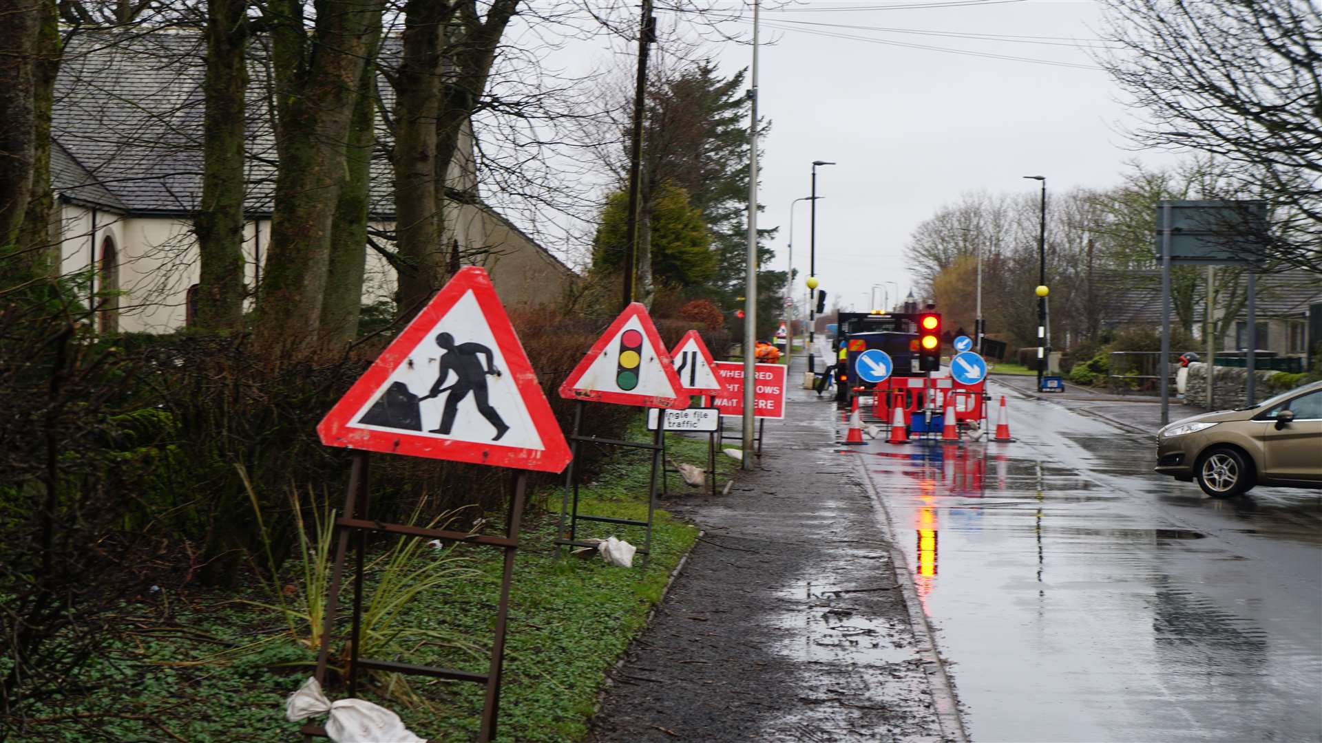 Temporary traffic lights set up in Watten as work gets underway this morning. Picture: DGS