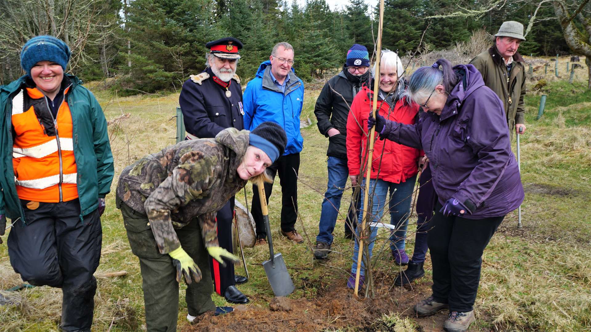 The tree gets a final push down from all the boots of those who attended the event. Picture: DGS
