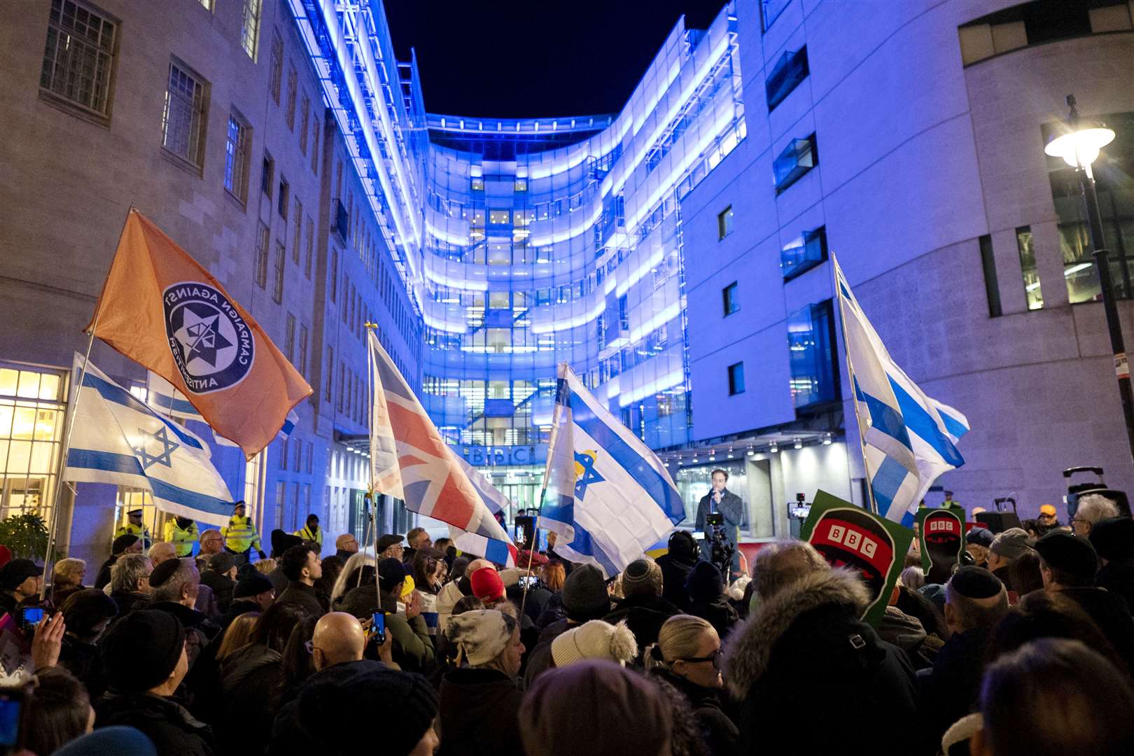 People take part in a protest outside Broadcasting House organised by the Campaign Against Antisemitism (Ben Whitley/PA Wire)