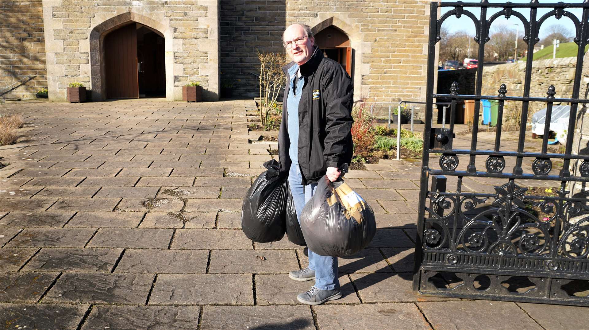David Shand takes bags of goods into the St Fergus Church. Picture: DGS