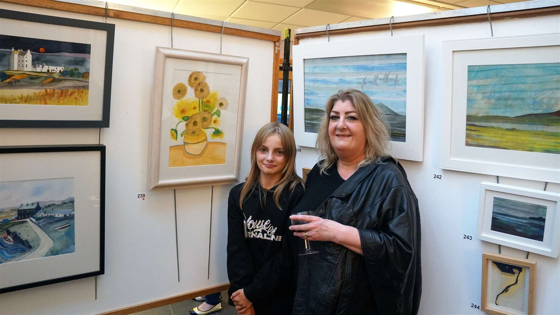 Ava Matheson beside her painted tribute to Vincent van Gogh and with her grandmother Jackie Newton who is an established artist. Picture: DGS