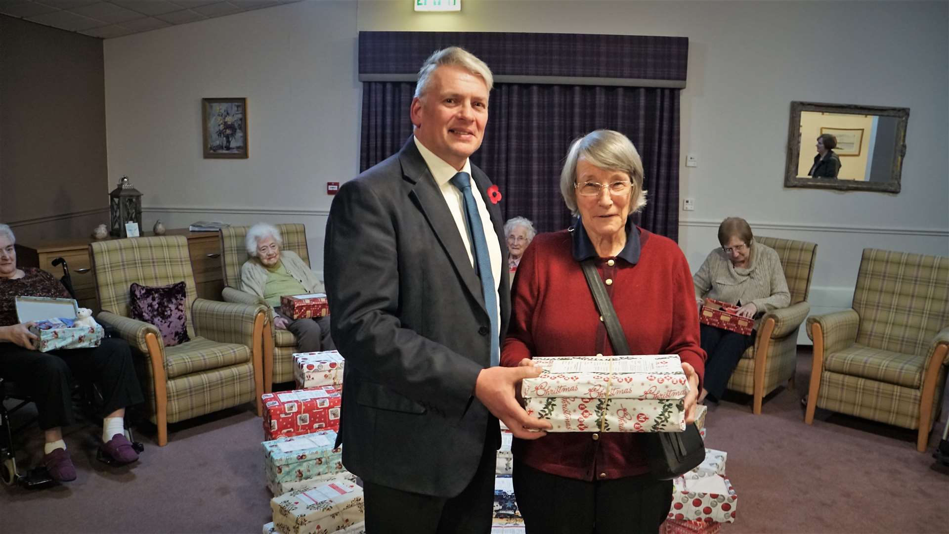 The Rev David Malcolm with Isobel Ferrier of Pentland View care home. Isobel was one of the many residents who helped fill the charity boxes.