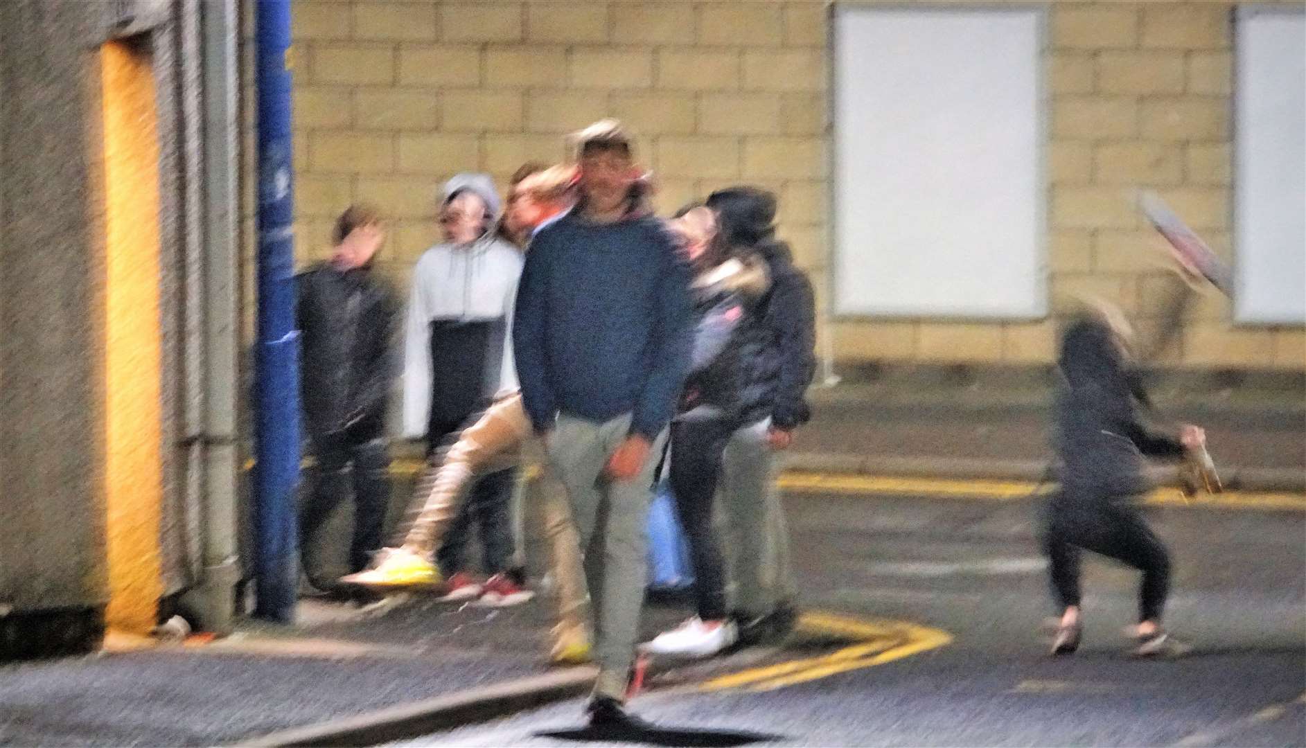 A gang of youths outside the public toilets on Tuesday evening. Some were drinking beer and one smashed his empty bottle on the pavement beside the Whitechapel Road facility. Police attended the scene soon after this picture was taken. Their faces have been blurred out.