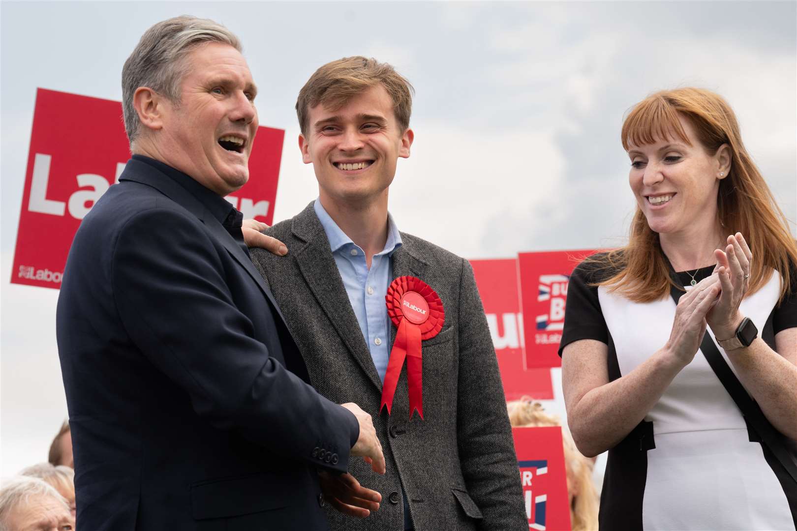 Newly-elected Labour MP Keir Mather (centre) is congratulated by Labour leader Sir Keir Starmer and deputy leader Angela Rayner at Selby football club in North Yorkshire (Stefan Rousseau/PA)