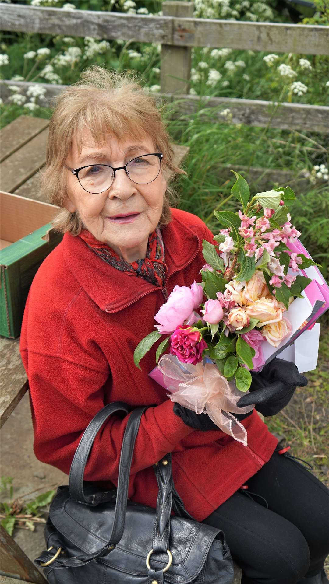 Marjory Scott told the children about rural life at her home near Lybster in the 1930s and 40s. She was presented with a flower bouquet by the children after the event. Picture: DGS