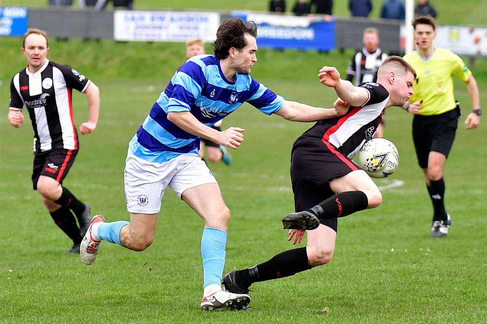 Wick striker Marc Macgregor is pushed to the ground by Jevan Anderson of Banks O' Dee. Picture: Mel Roger
