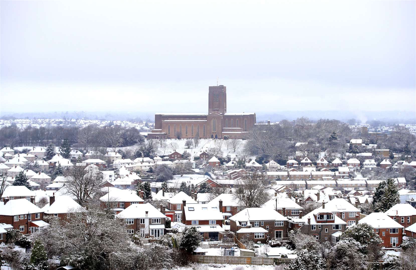 A snowy scene around Guildford Cathedral (Adam Davy/PA)