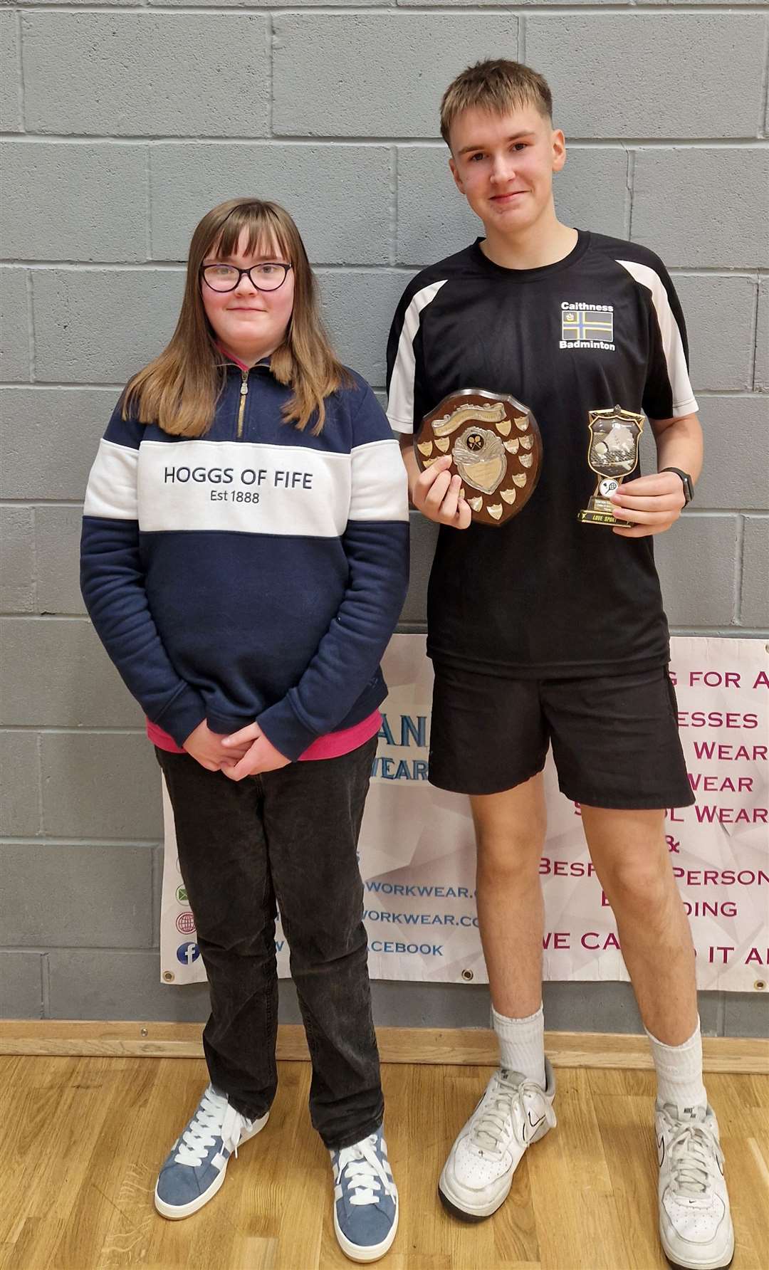 Boys' singles winners Alexander Mackay with Lexie Mackenzie from Highland Workwear.