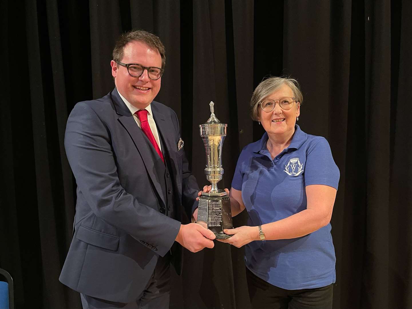 Marney Bruce of Wick Players receiving the Young Trophy from adjudicator Ben Humphrey. Picture: John Firth