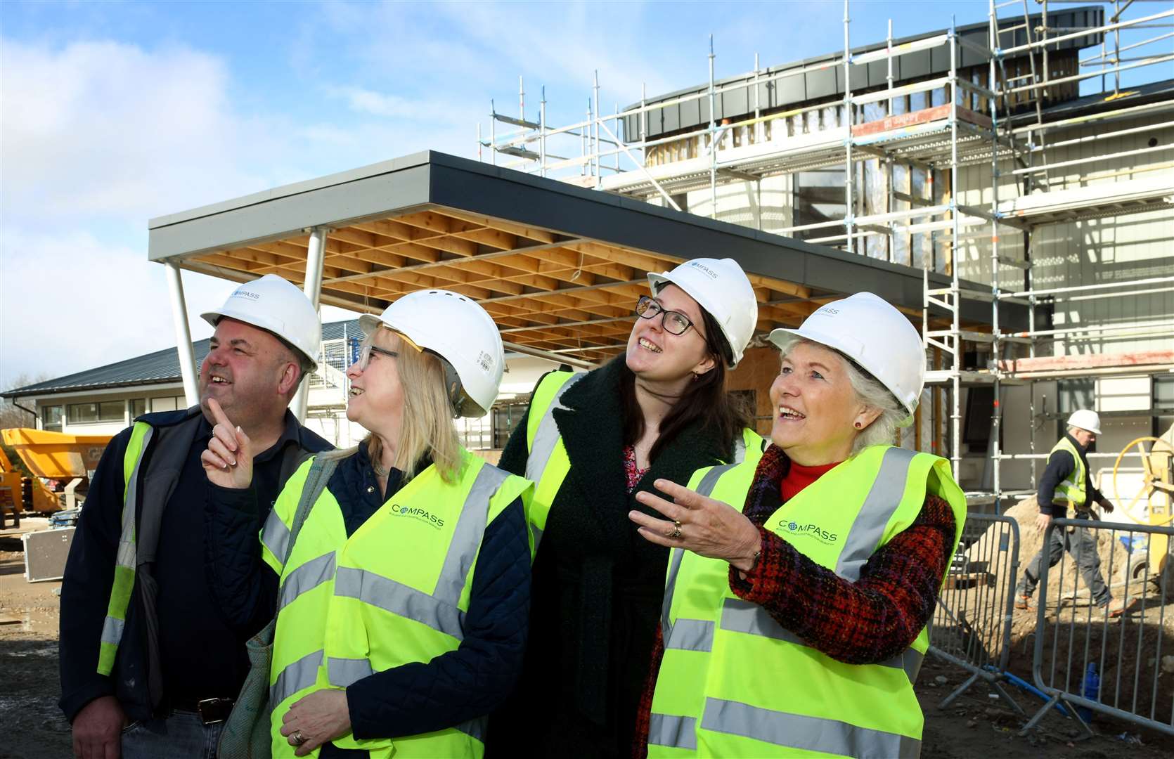 Elsie Normington (right) sees construction work progress in April during a tour with site manager Greg Cooper, community fundraiser Rona Matheson and Equalities Minister Emma Roddick.