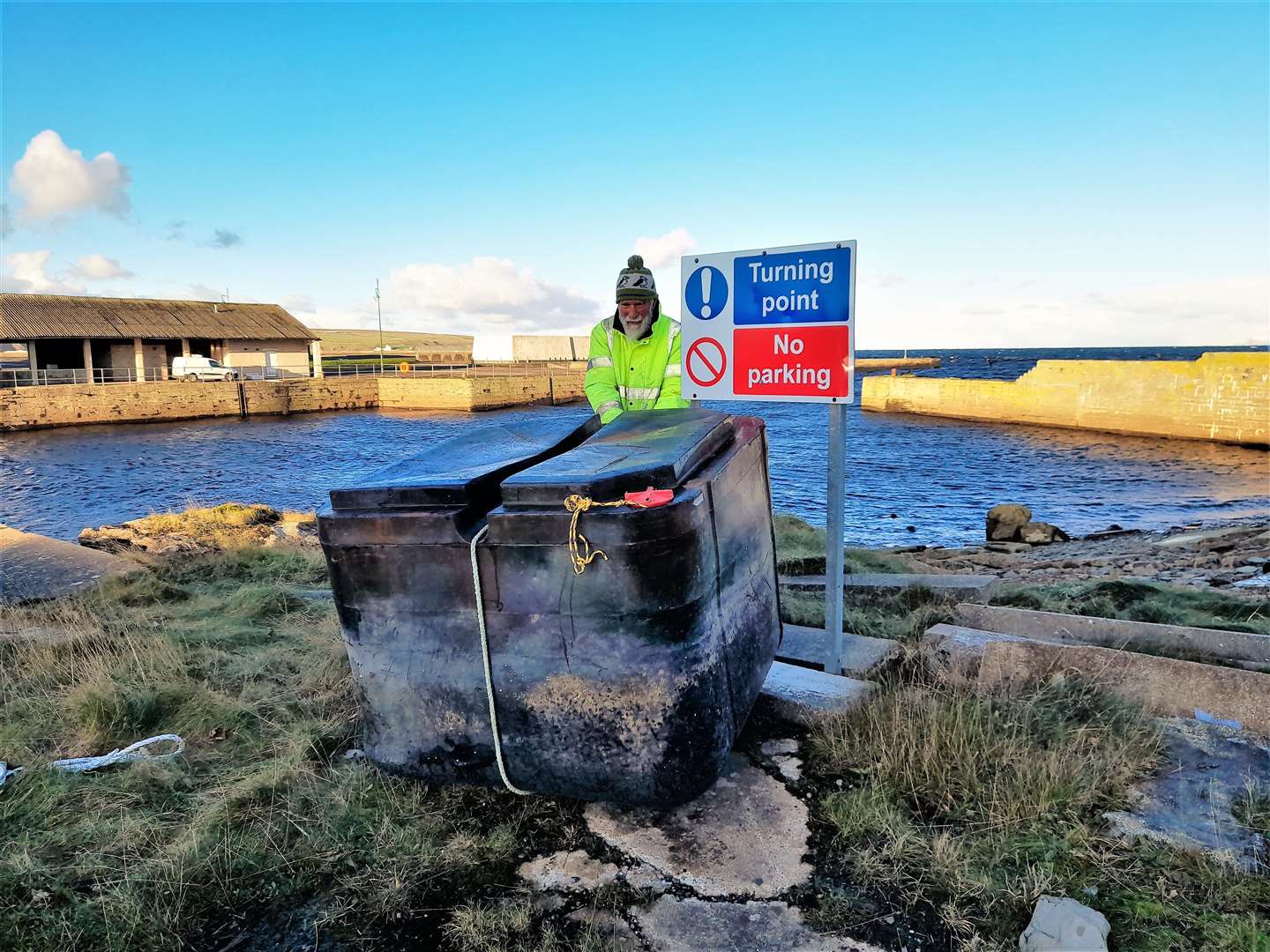 Allan Sinclair and his wife Dorcas had to empty the huge box from the water in it before it could be taken from the coast.